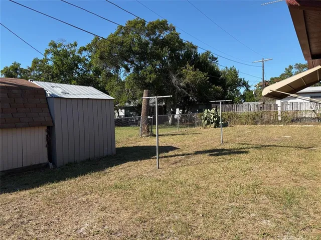 a backyard of a house with palm tree