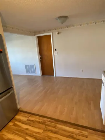 a view of a big room with wooden floor