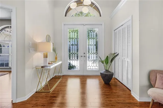 a view of an entryway with wooden floor