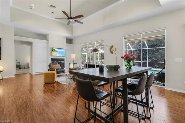 a view of a dining room with furniture and wooden floor