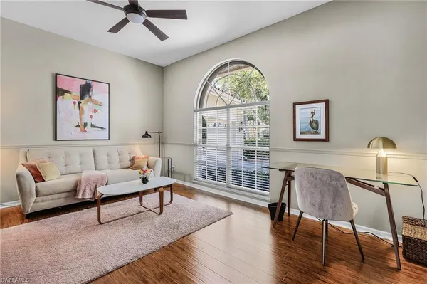 a living room with furniture and a window