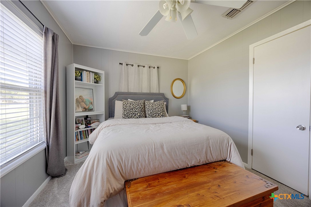 207 River Street Hallettsville, TX 77964 - Photo 14 of 25 a bedroom with a bed and a window