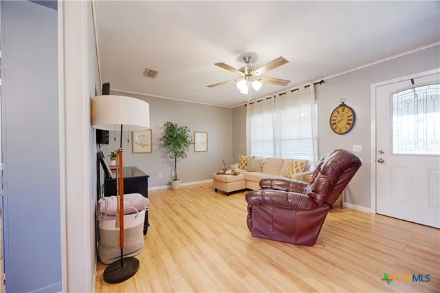 a living room with furniture and a window