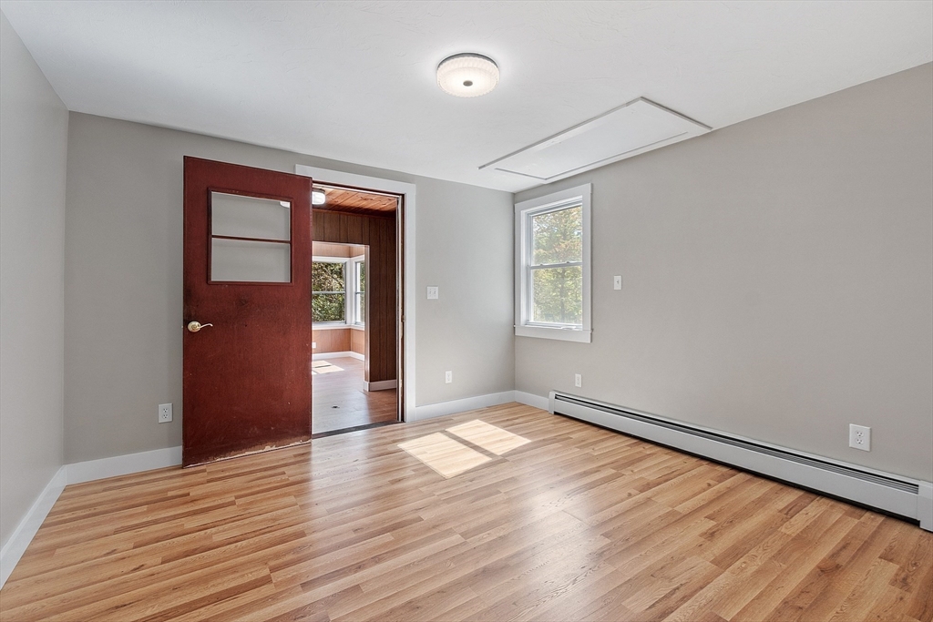 34 Morse Road Royalston, MA 01368 - Photo 22 of 42 an empty room with wooden floor and windows