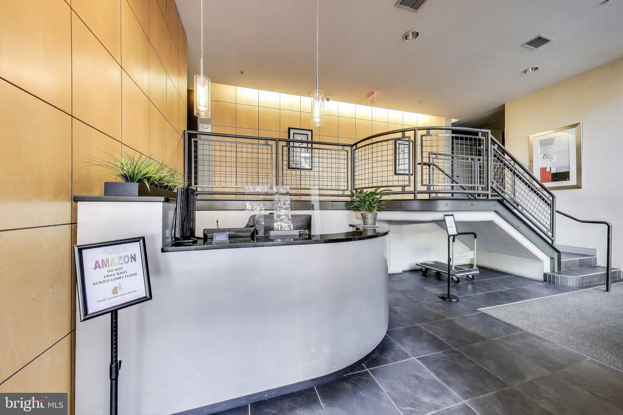 2020 12th Street Northwest, Unit 506 Washington, DC 20009 - Photo 4 of 7 a view of staircase with a table and chairs