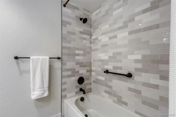 a bathroom with a shower and a bathtub
