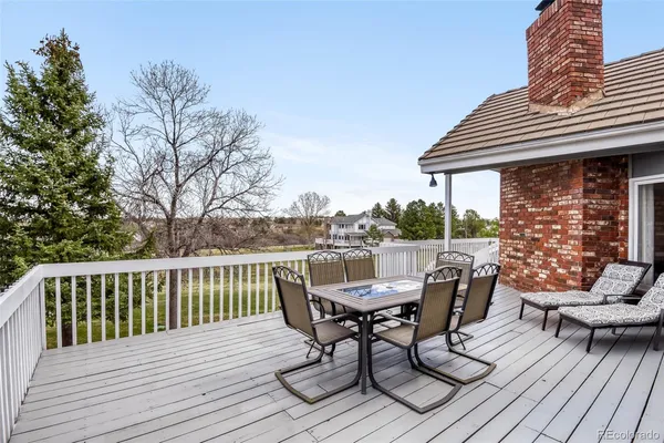 a view of a deck with furniture