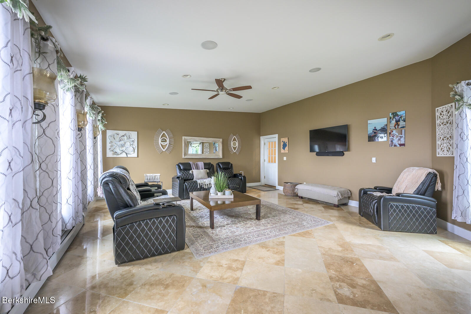 140 Hancock Road Pittsfield, MA 01201 - Photo 22 of 40 a living room with furniture and a flat screen tv
