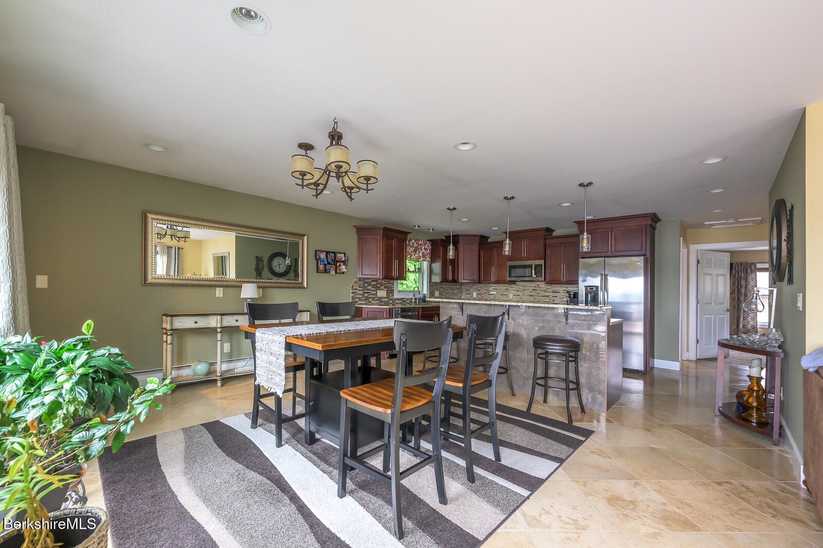 140 Hancock Road Pittsfield, MA 01201 - Photo 24 of 40 a living room with lots of furniture and a painting on the wall