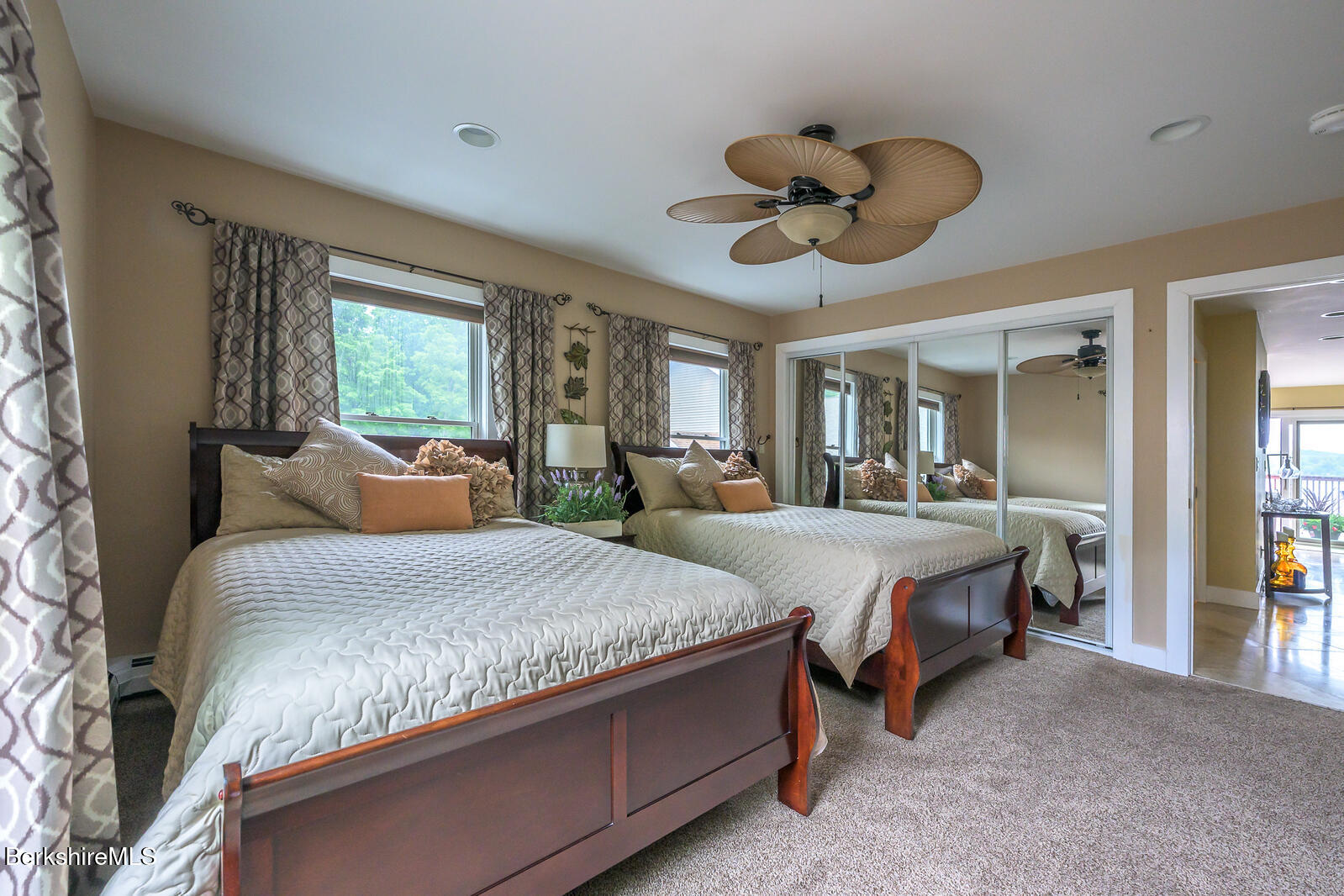 140 Hancock Road Pittsfield, MA 01201 - Photo 27 of 40 a bedroom with a bed and ceiling fan