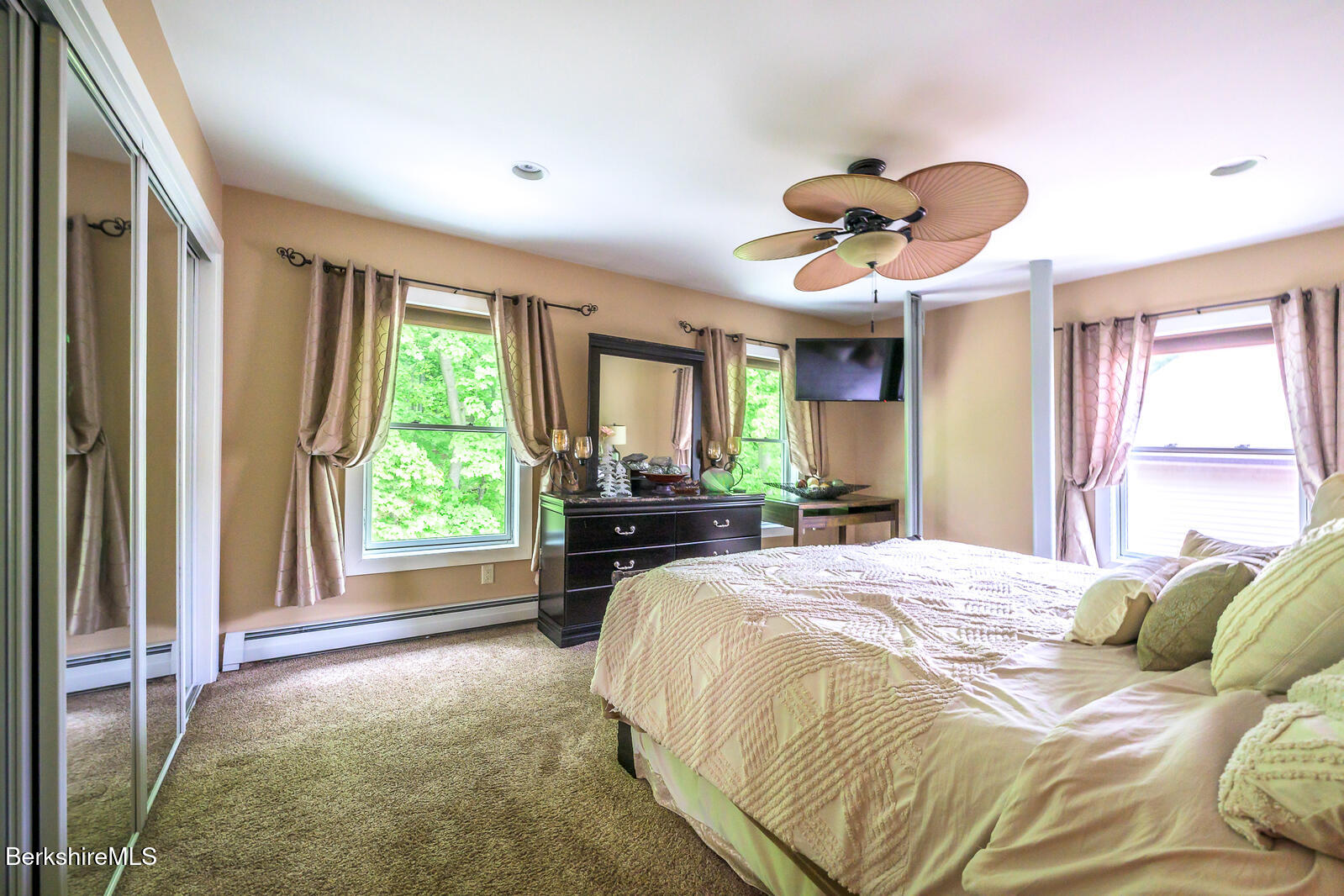 140 Hancock Road Pittsfield, MA 01201 - Photo 28 of 40 a spacious bedroom with a large bed and a large window