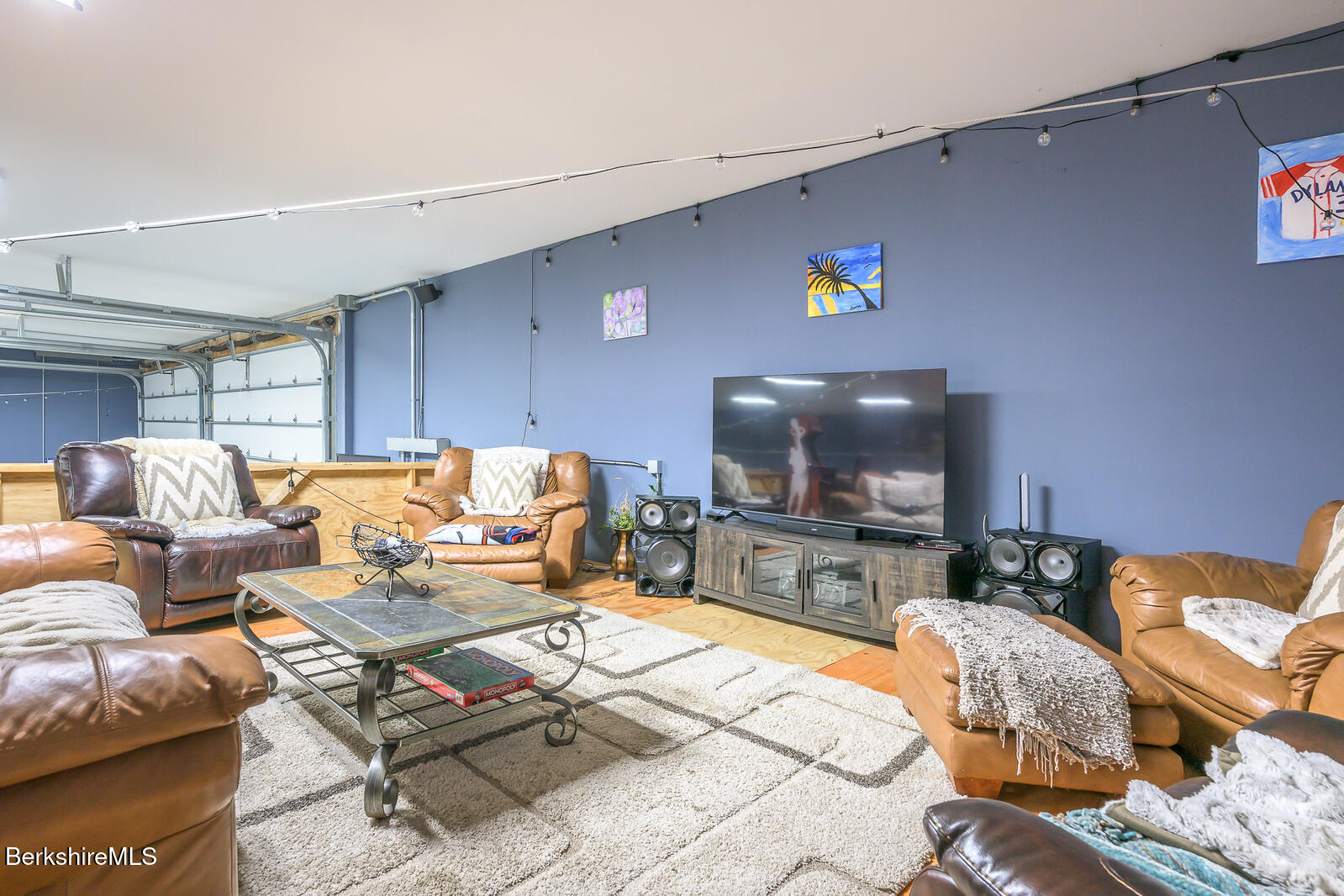 140 Hancock Road Pittsfield, MA 01201 - Photo 33 of 40 a living room with furniture and a flat screen tv
