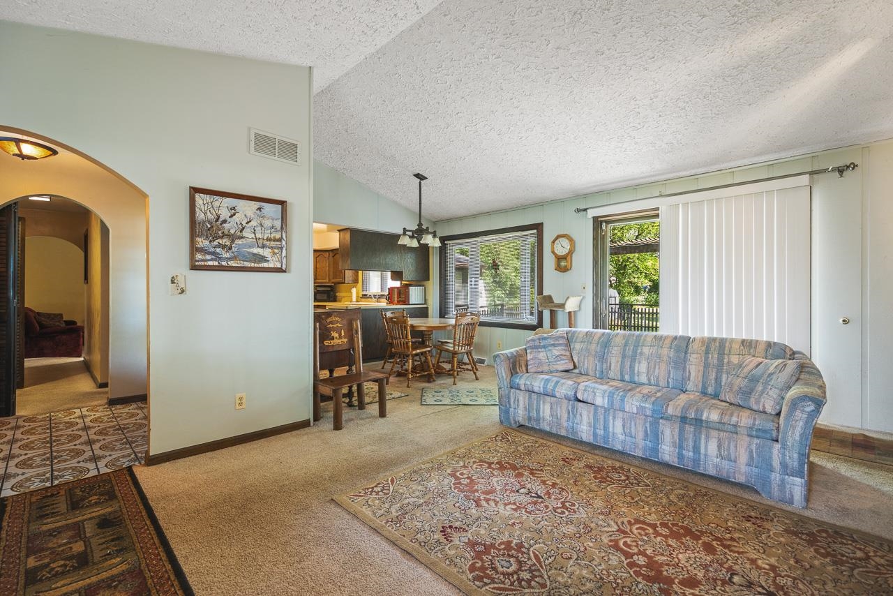 6537 Newburg Road Rockford, IL 61108 - Photo 12 of 29 a living room with furniture and a table