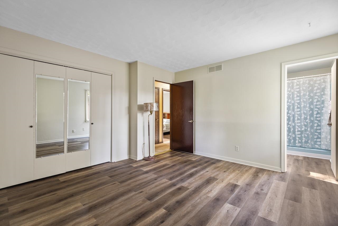 6537 Newburg Road Rockford, IL 61108 - Photo 16 of 29 a view of empty room with wooden floor and entryway