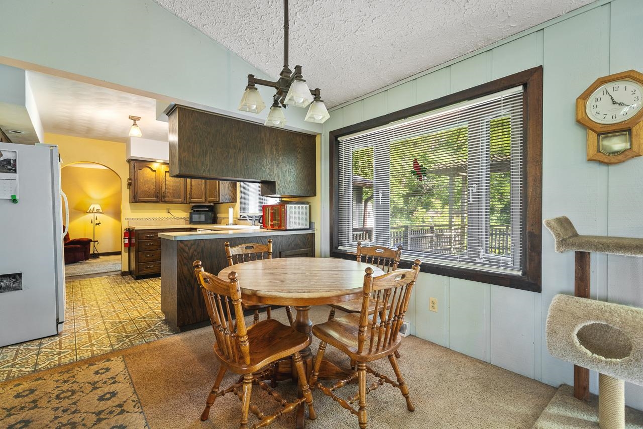 6537 Newburg Road Rockford, IL 61108 - Photo 20 of 29 a view of a dining room with furniture window and wooden floor