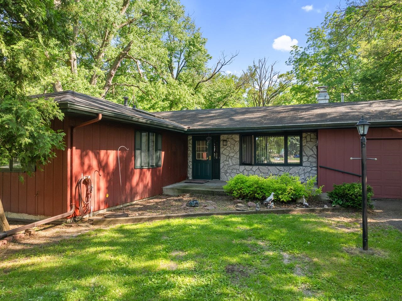 6537 Newburg Road Rockford, IL 61108 - Photo 2 of 29 a front view of a house with a yard