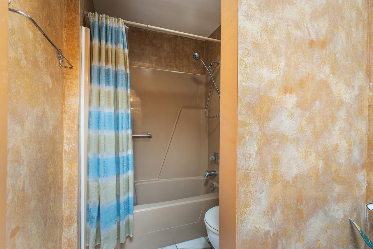 6537 Newburg Road Rockford, IL 61108 - Photo 23 of 29 a bathroom with a shower and a toilet