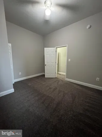 an empty room with a empty space and a window