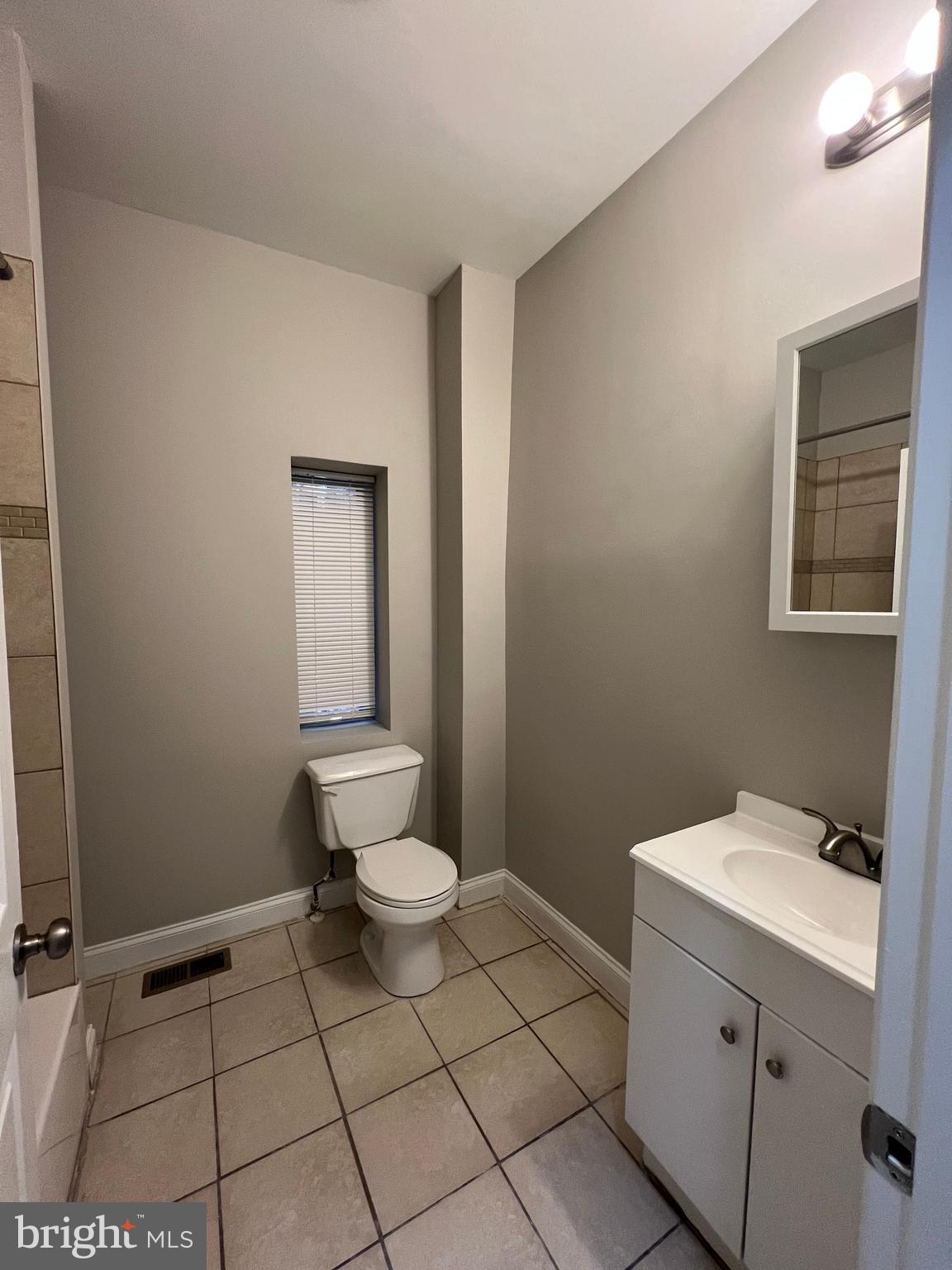 2014 McCulloh Street, Unit 1 Baltimore, MD 21217 - Photo 10 of 10 a bathroom with a sink toilet and vanity