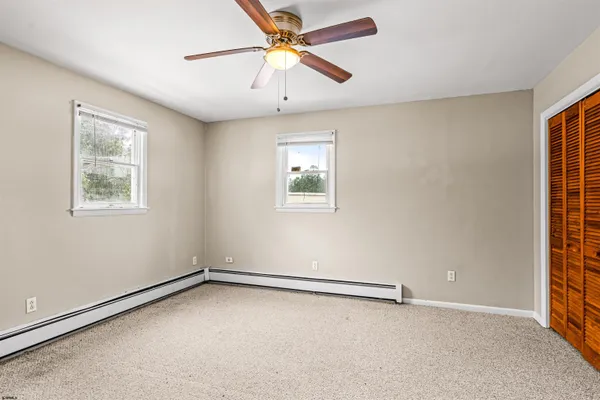 a view of living room with furniture and chandelier