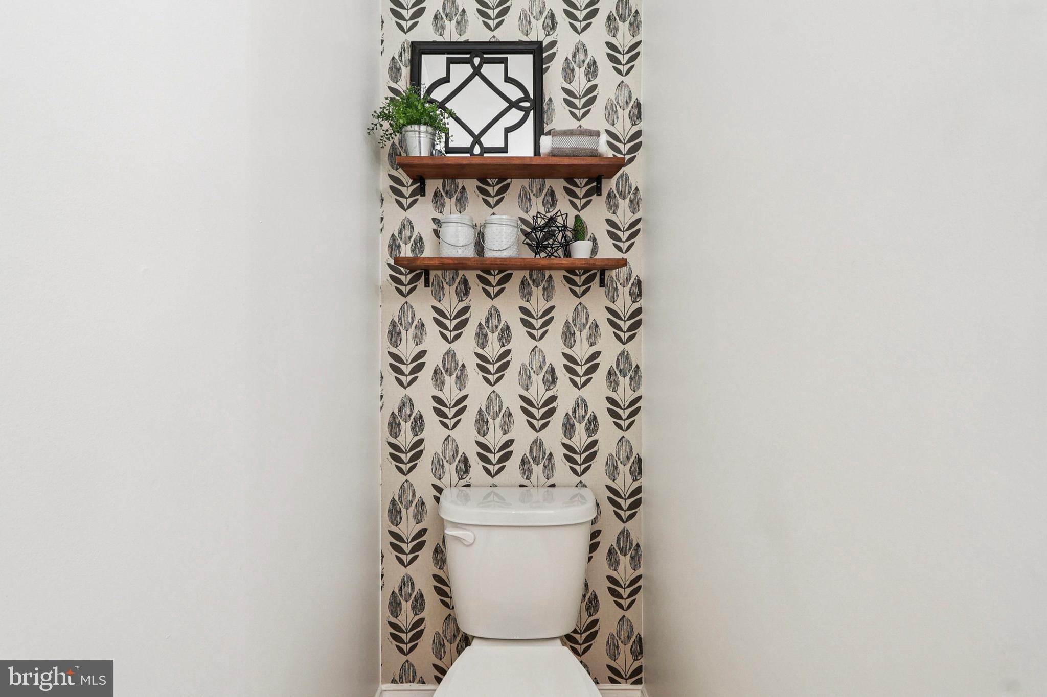 4505 Potomac Highlands Circle Triangle, VA 22172 - Photo 34 of 65 a bathroom with a toilet and a shower curtain