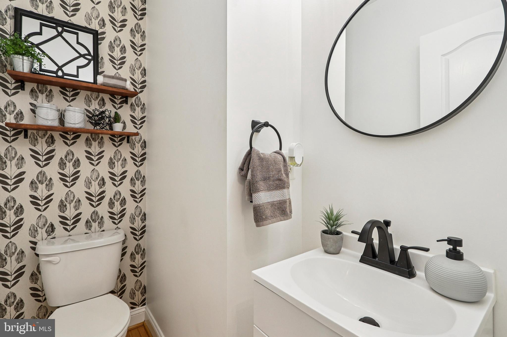 4505 Potomac Highlands Circle Triangle, VA 22172 - Photo 35 of 65 a bathroom with a sink mirror and toilet