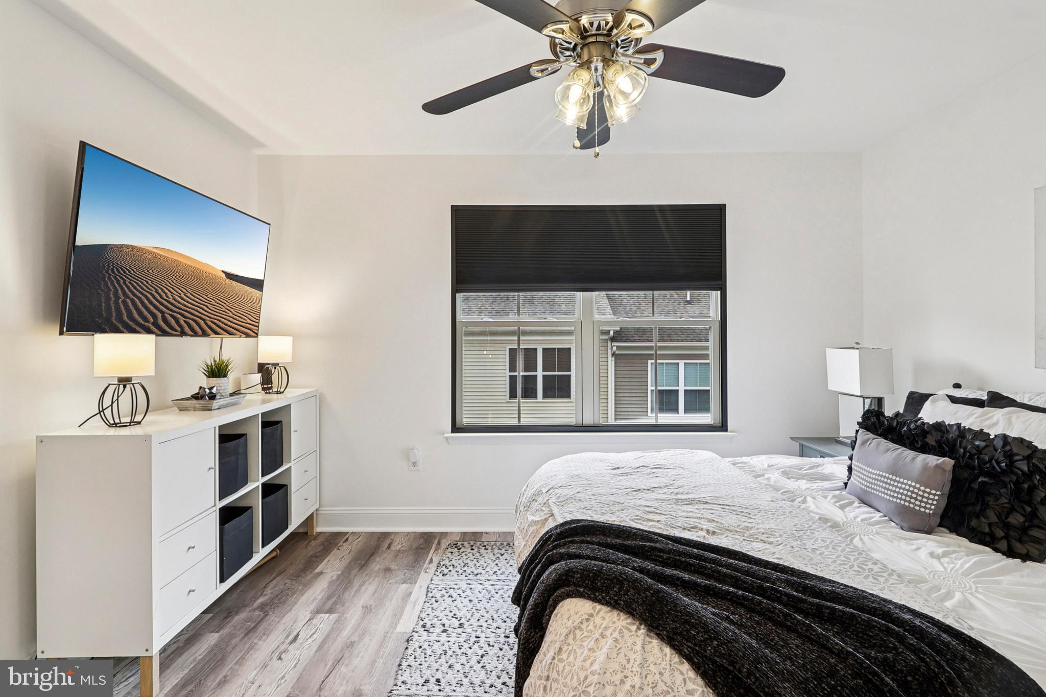 4505 Potomac Highlands Circle Triangle, VA 22172 - Photo 39 of 65 a bedroom with a bed and a flat screen tv