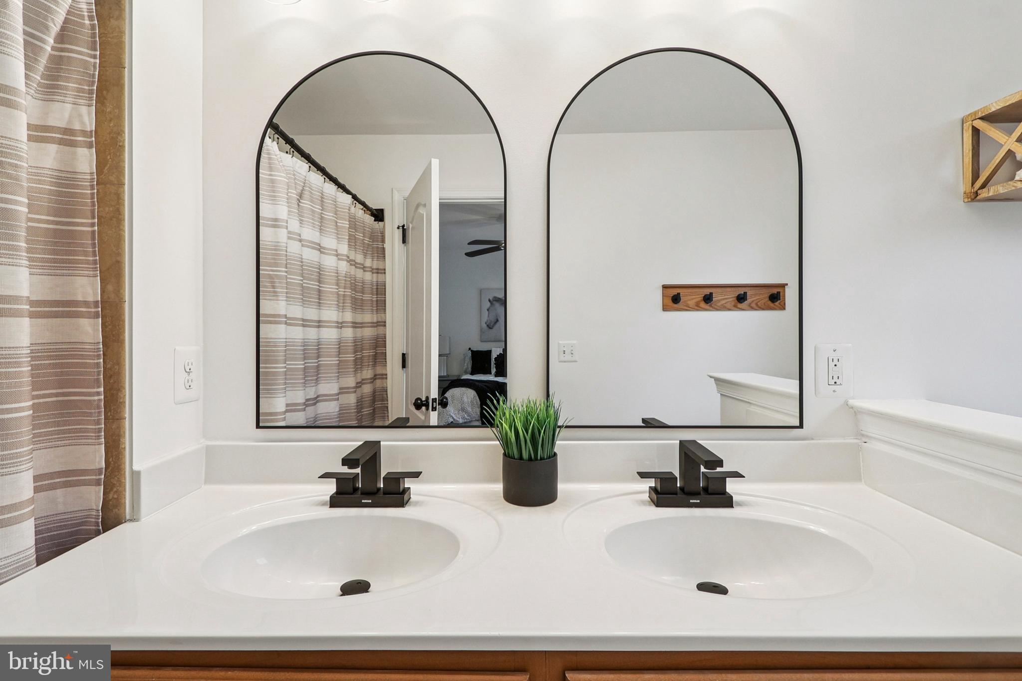 4505 Potomac Highlands Circle Triangle, VA 22172 - Photo 42 of 65 a bathroom with a sink and a mirror