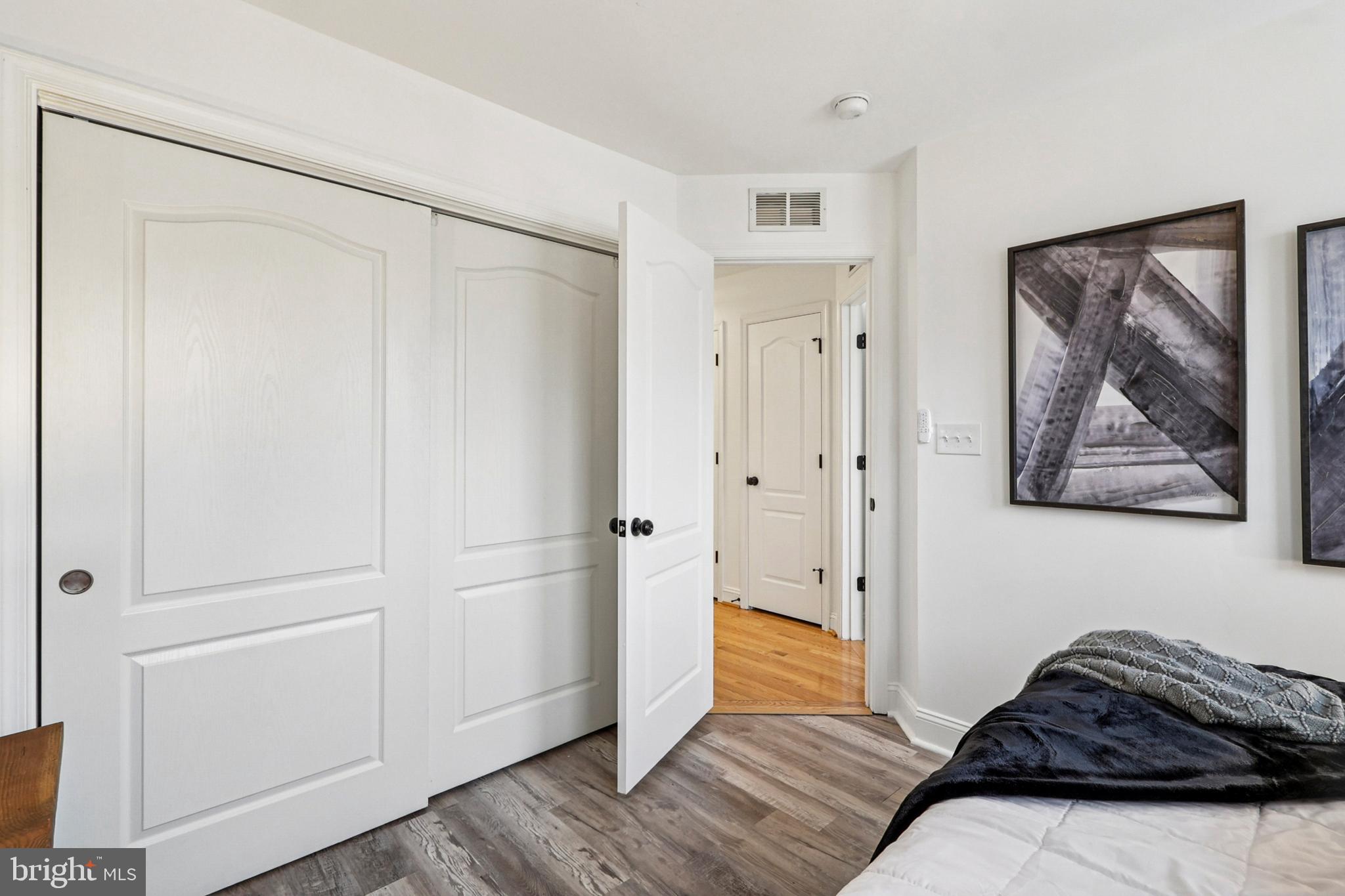 4505 Potomac Highlands Circle Triangle, VA 22172 - Photo 51 of 65 a bedroom with a bed and a painting on the wall
