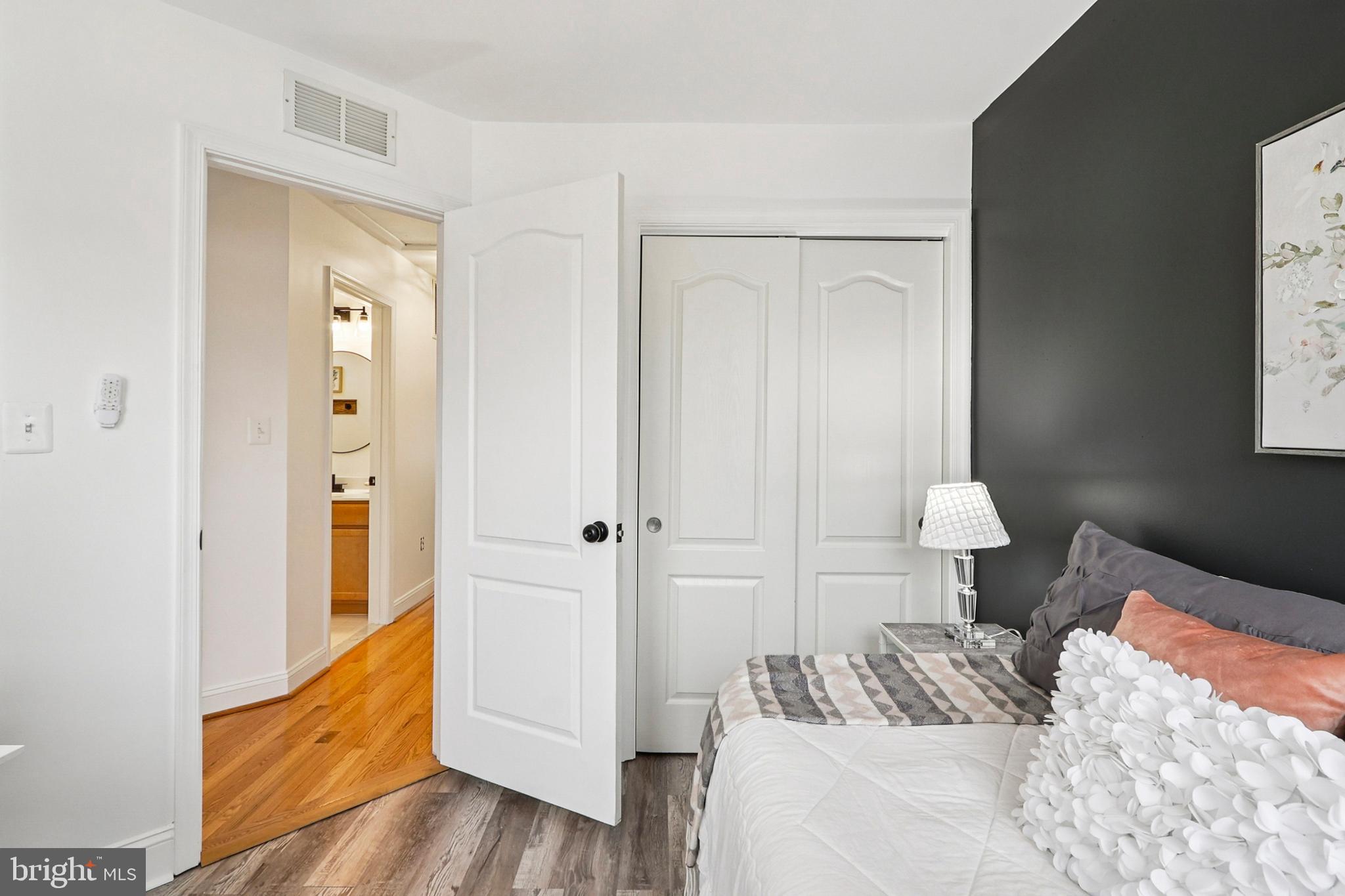 4505 Potomac Highlands Circle Triangle, VA 22172 - Photo 53 of 65 a bedroom with a bed and a mirror