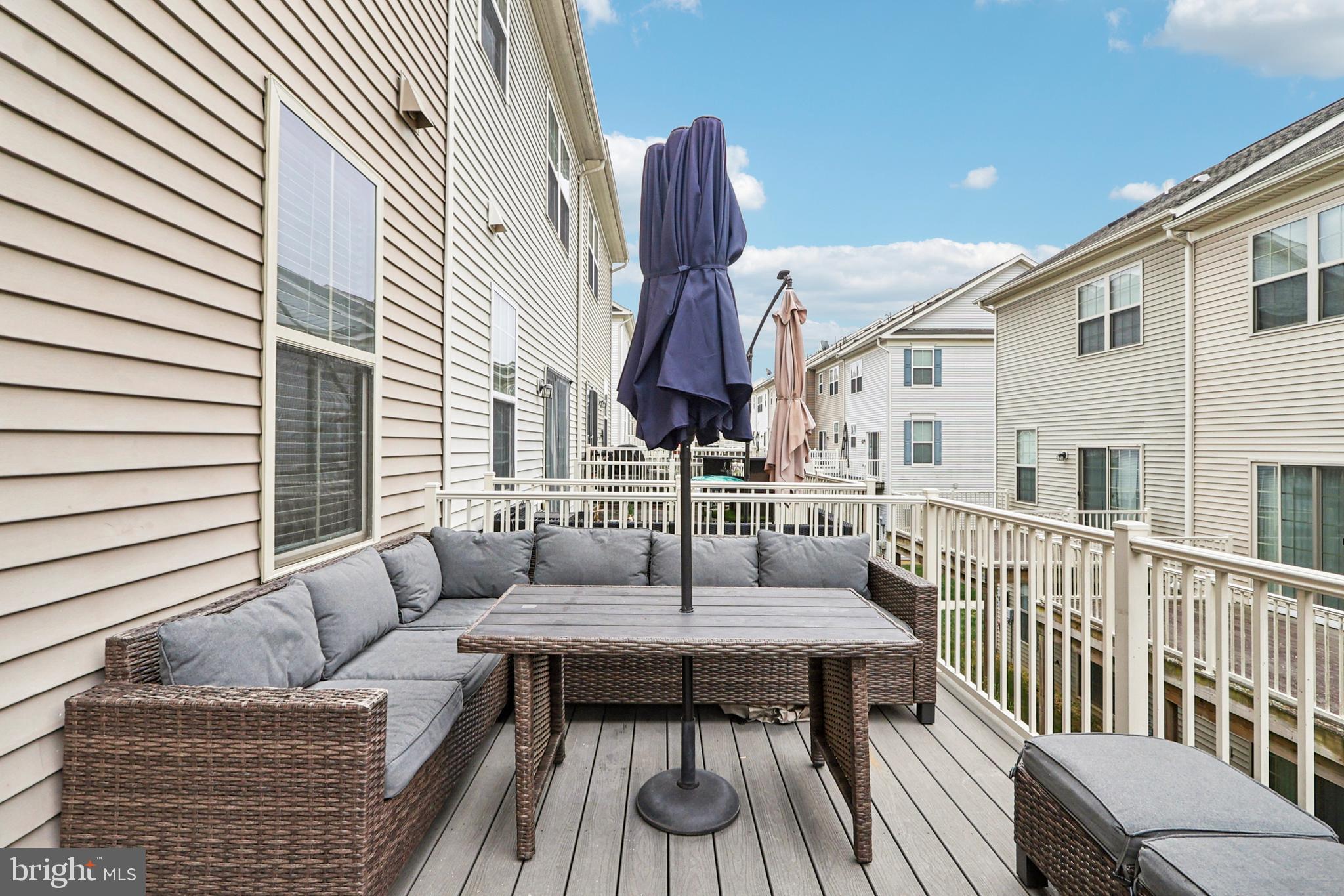 4505 Potomac Highlands Circle Triangle, VA 22172 - Photo 56 of 65 a balcony with furniture and wooden floor