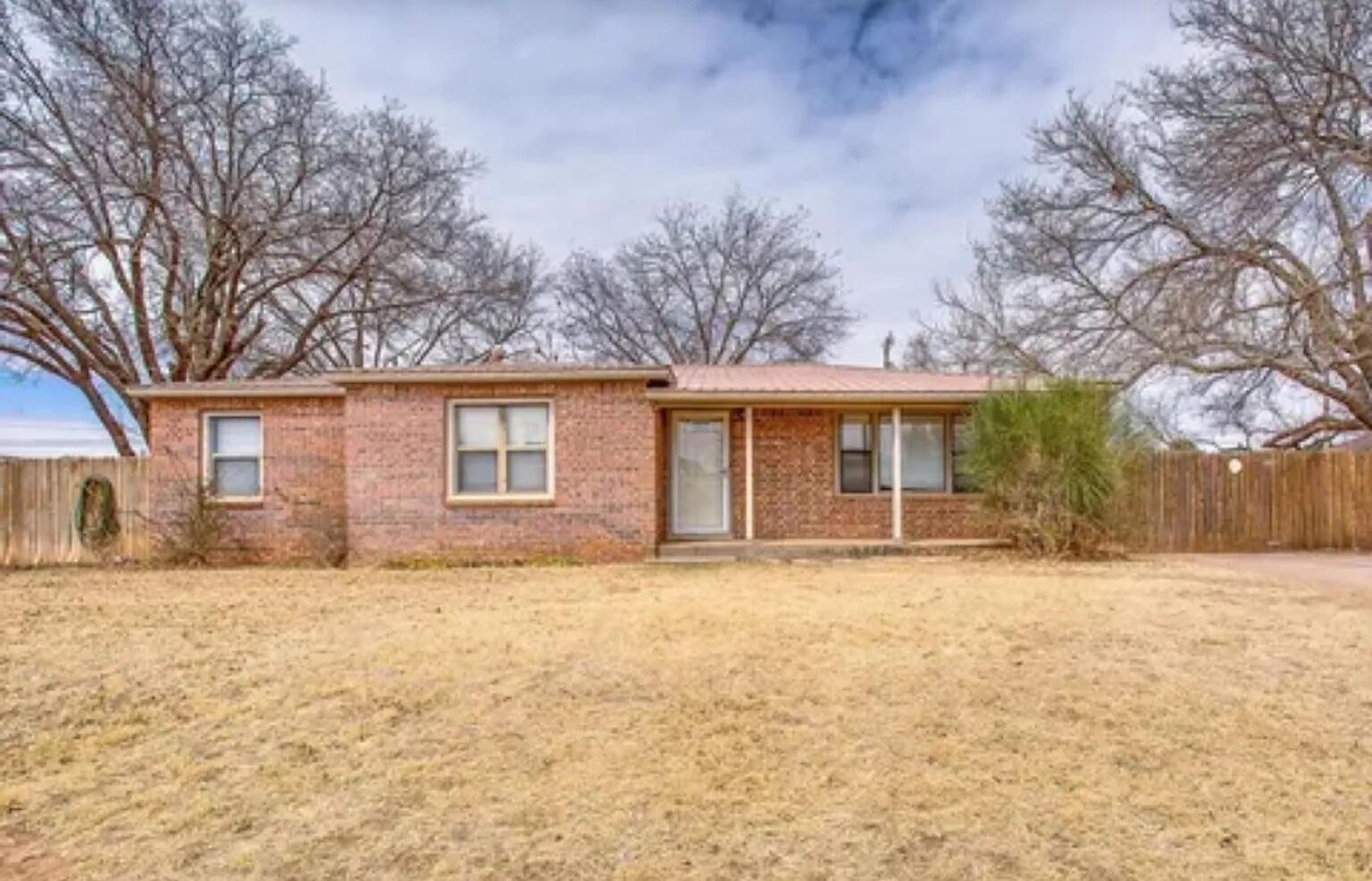 4906 60th Street Lubbock, TX 79414 - Photo 7 of 7 a front view of a house with a yard covered with snow