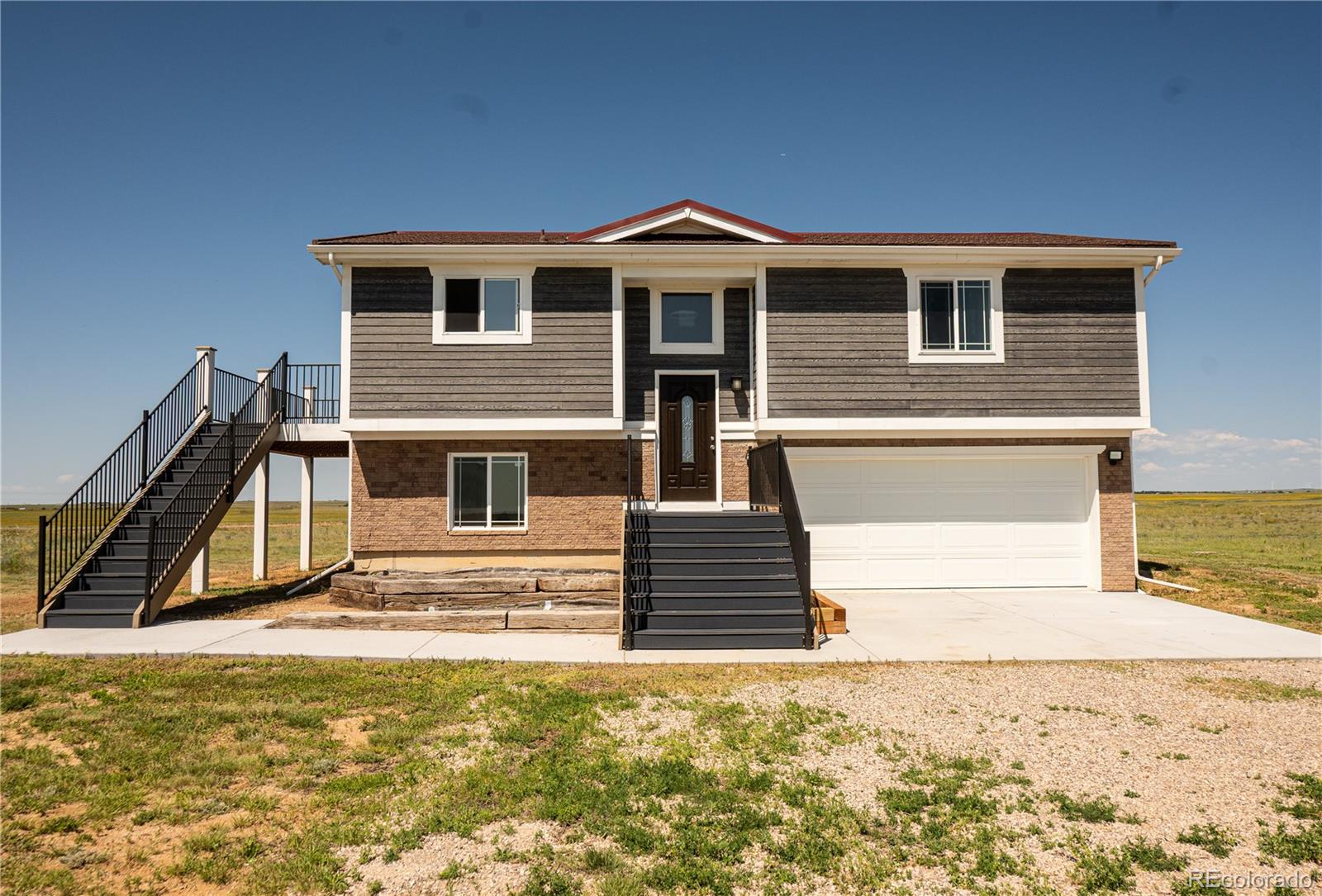 a view of a house with a ocean view