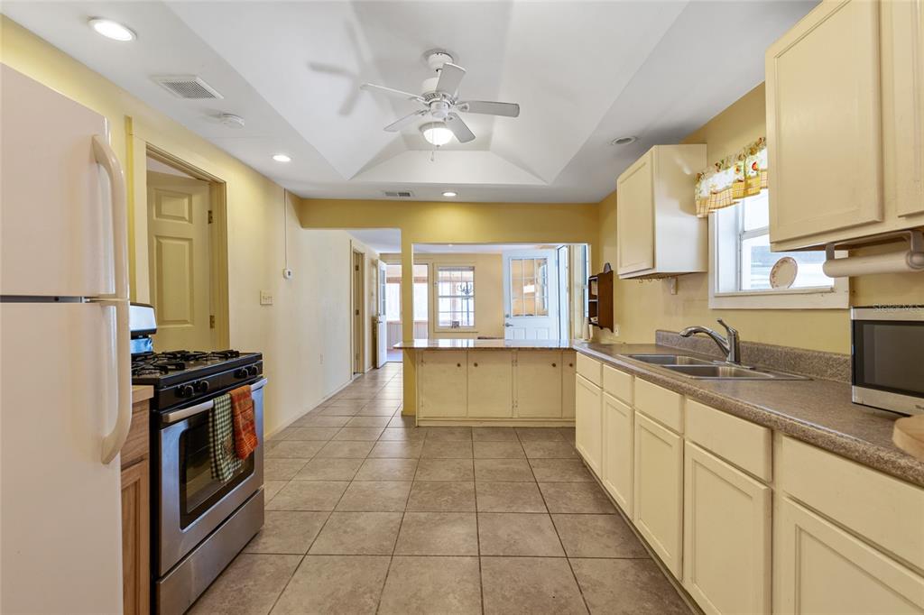 1317 Northeast Drew Road Lake City, FL 32055 - Photo 11 of 32 a large white kitchen with a large window
