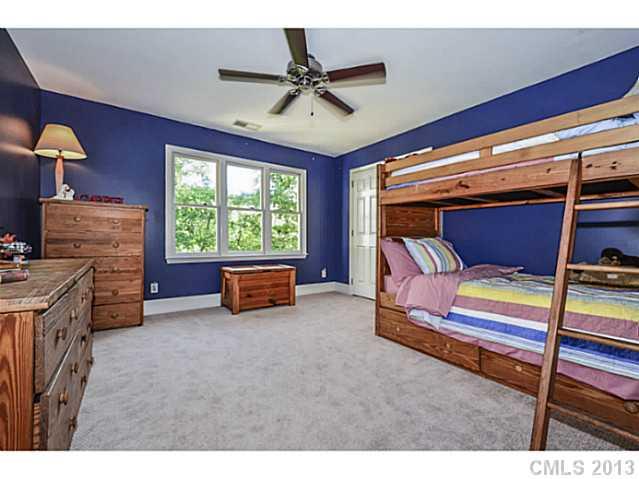 700 Beacon Knoll Lane Fort Mill, SC 29708 - Photo 14 of 16 a bedroom with furniture and a ceiling fan