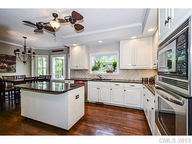 700 Beacon Knoll Lane Fort Mill, SC 29708 - Photo 9 of 16 a kitchen with stainless steel appliances granite countertop a sink and a stove