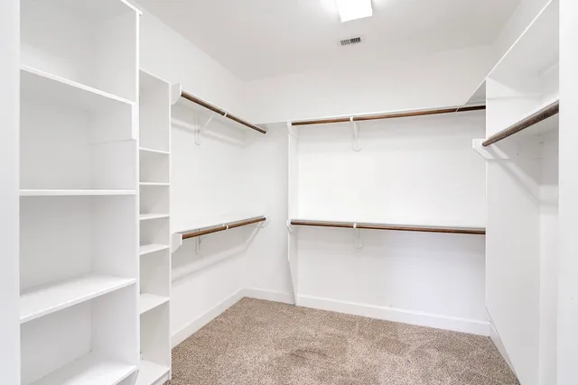 a view of an empty walk in closet
