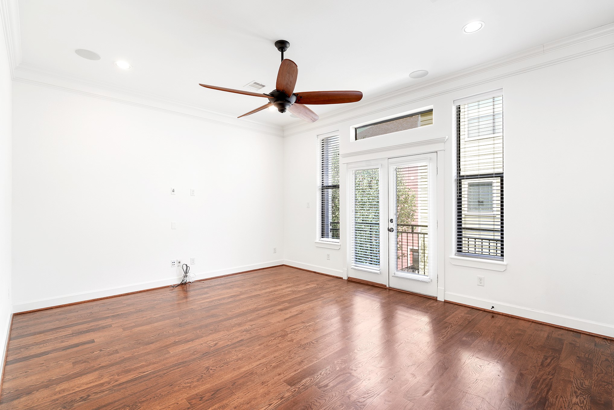 612 West 27th Street Houston, TX 77008 - Photo 10 of 33 an empty room with wooden floor fan and windows