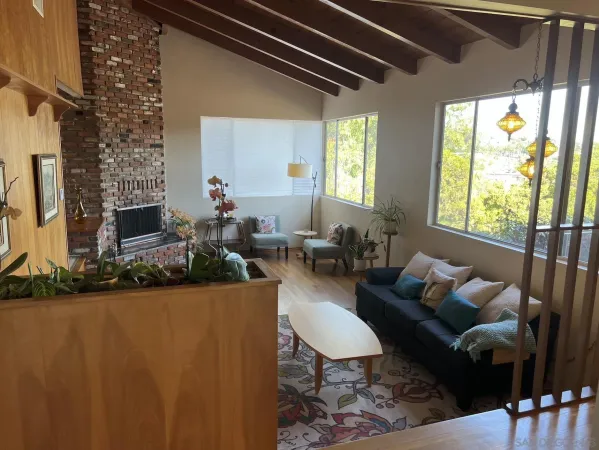 a room with wooden cabinets a sink and a stove
