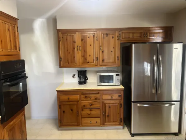 a bed room with a bed window and a table