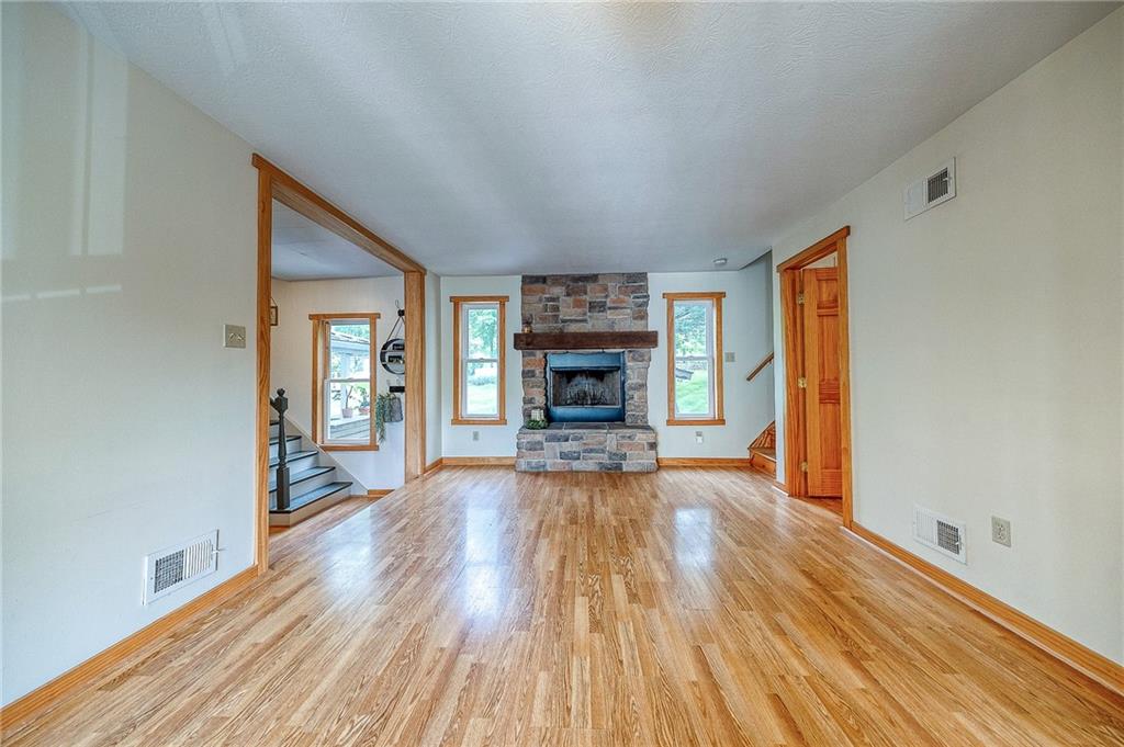 424 Joffre Cherry Valley Road Burgettstown, PA 15021 - Photo 17 of 40 a view of a livingroom with wooden floor and a fireplace