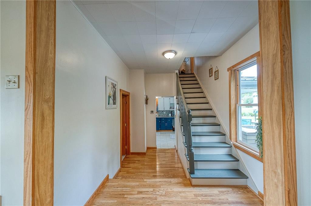 424 Joffre Cherry Valley Road Burgettstown, PA 15021 - Photo 20 of 40 a view of a hallway with wooden floor and staircase