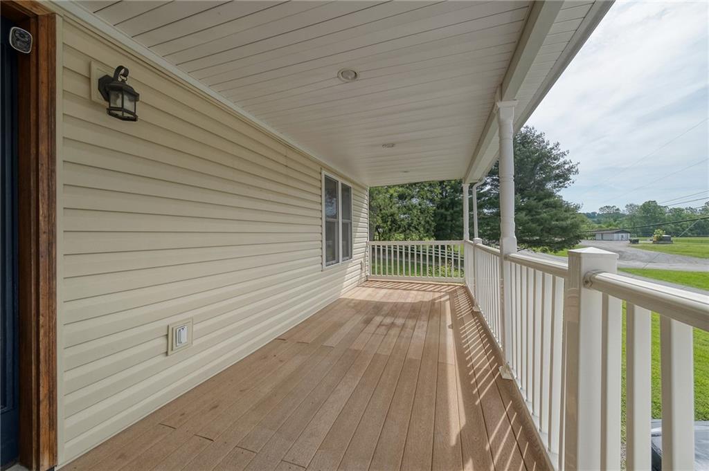 424 Joffre Cherry Valley Road Burgettstown, PA 15021 - Photo 2 of 40 a view of a balcony with wooden floor