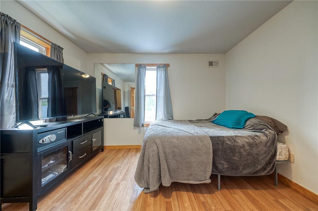 424 Joffre Cherry Valley Road Burgettstown, PA 15021 - Photo 39 of 40 a bedroom with a bed and a flat screen tv