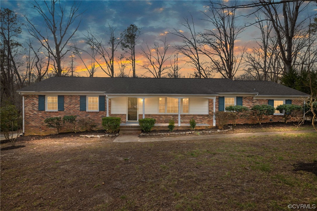 1818 Bloomfield Road Richmond, VA 23225 - Photo 1 of 45 a front view of a house with a garden and patio