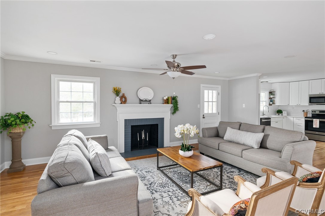 1818 Bloomfield Road Richmond, VA 23225 - Photo 11 of 45 a living room with furniture and a fireplace