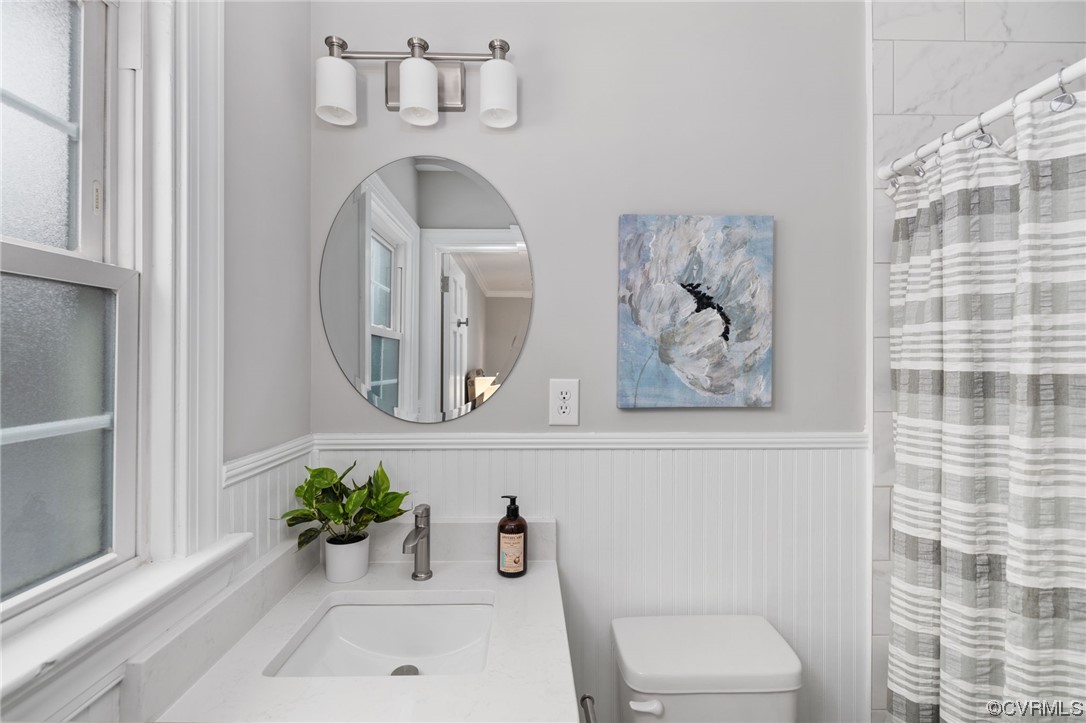 1818 Bloomfield Road Richmond, VA 23225 - Photo 21 of 45 a bathroom with a toilet and a sink