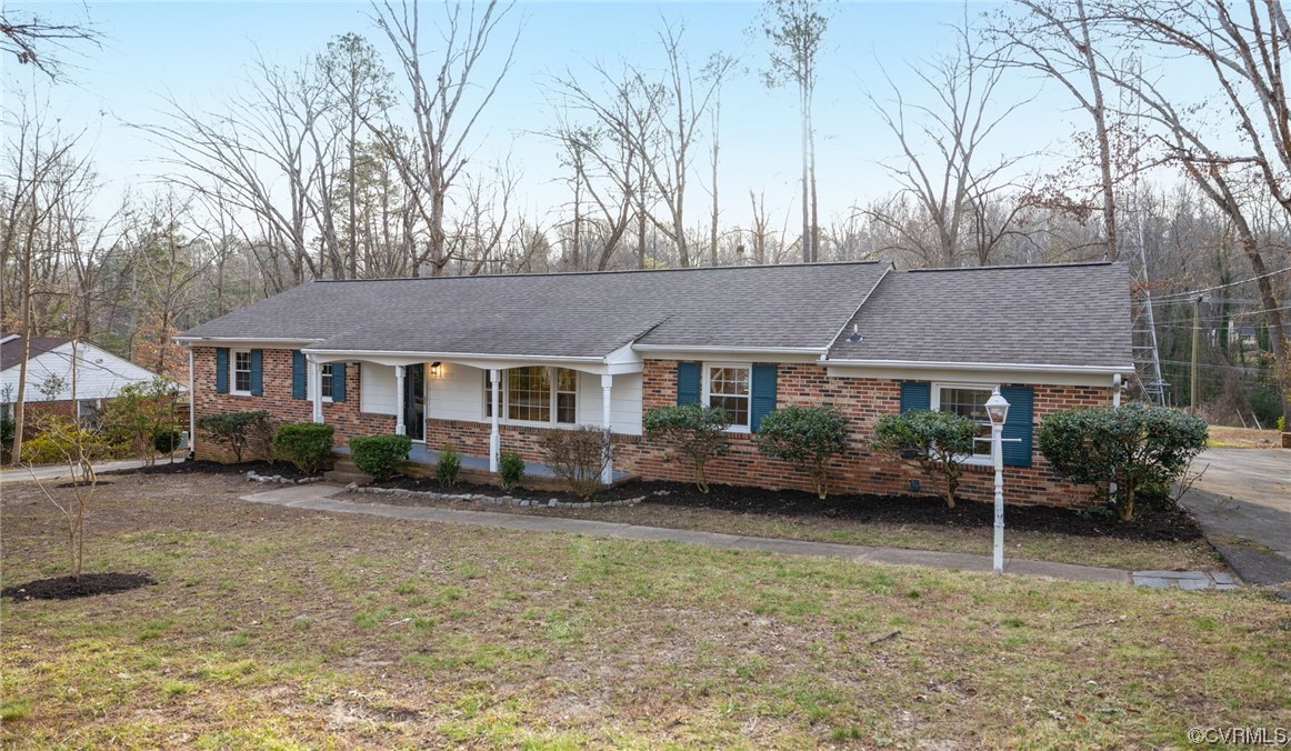 1818 Bloomfield Road Richmond, VA 23225 - Photo 3 of 45 a front view of a house with a garden