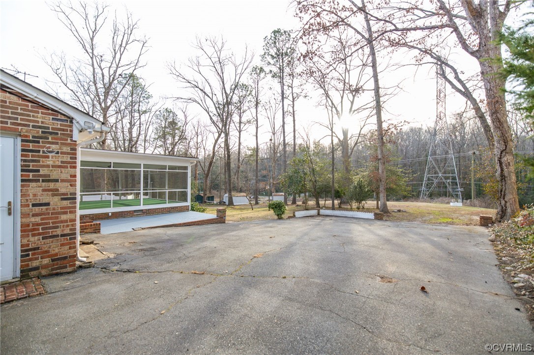 1818 Bloomfield Road Richmond, VA 23225 - Photo 32 of 45 a view of a house with backyard and trees