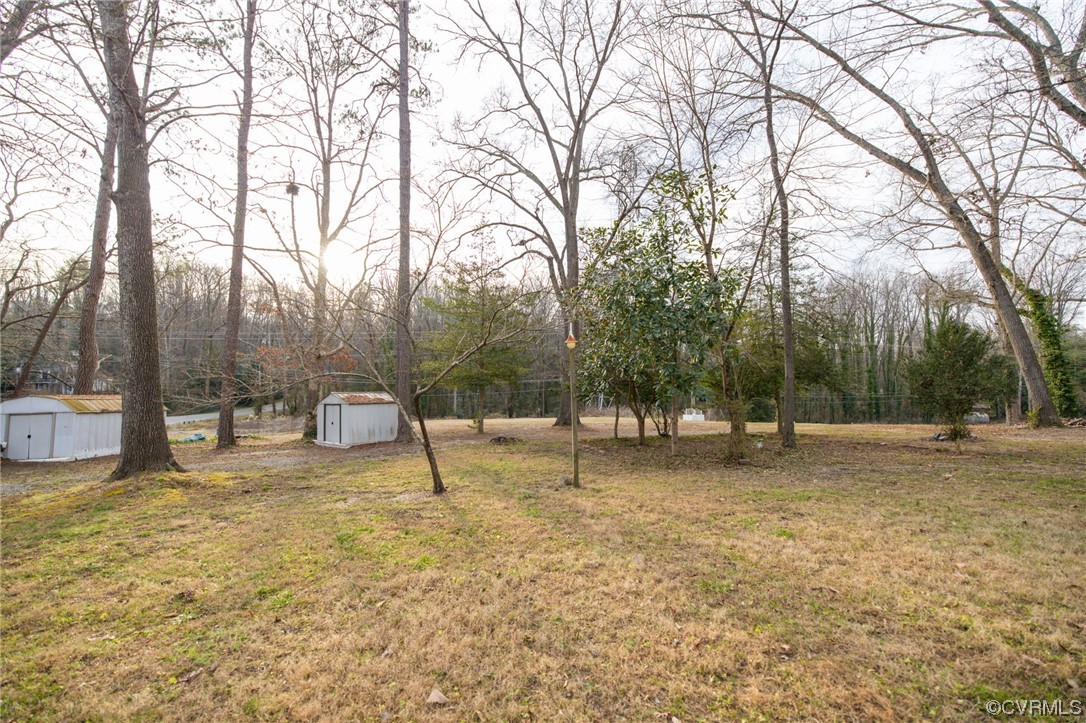 1818 Bloomfield Road Richmond, VA 23225 - Photo 34 of 45 a backyard of a house with table and chairs